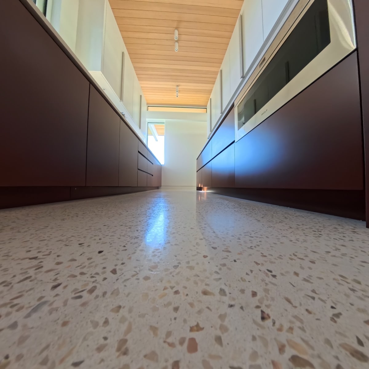 Close view of white terrazzo aggregate in a residential floor.