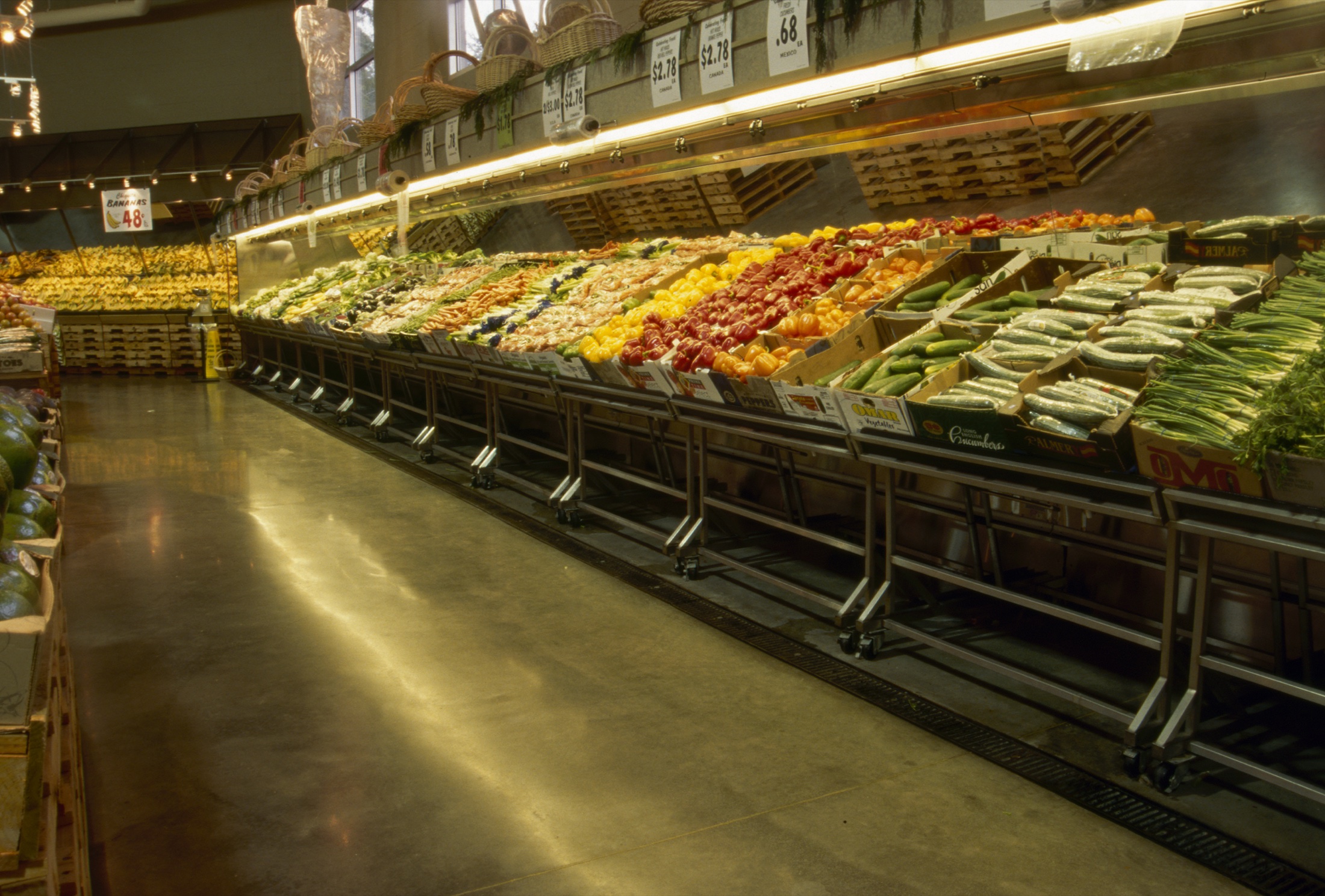 Unnamed grocery store produce area with polished concrete floor.