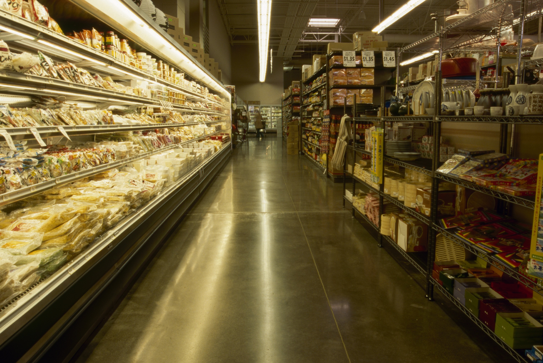 Unnamed grocery store aisle with polished concrete floor.