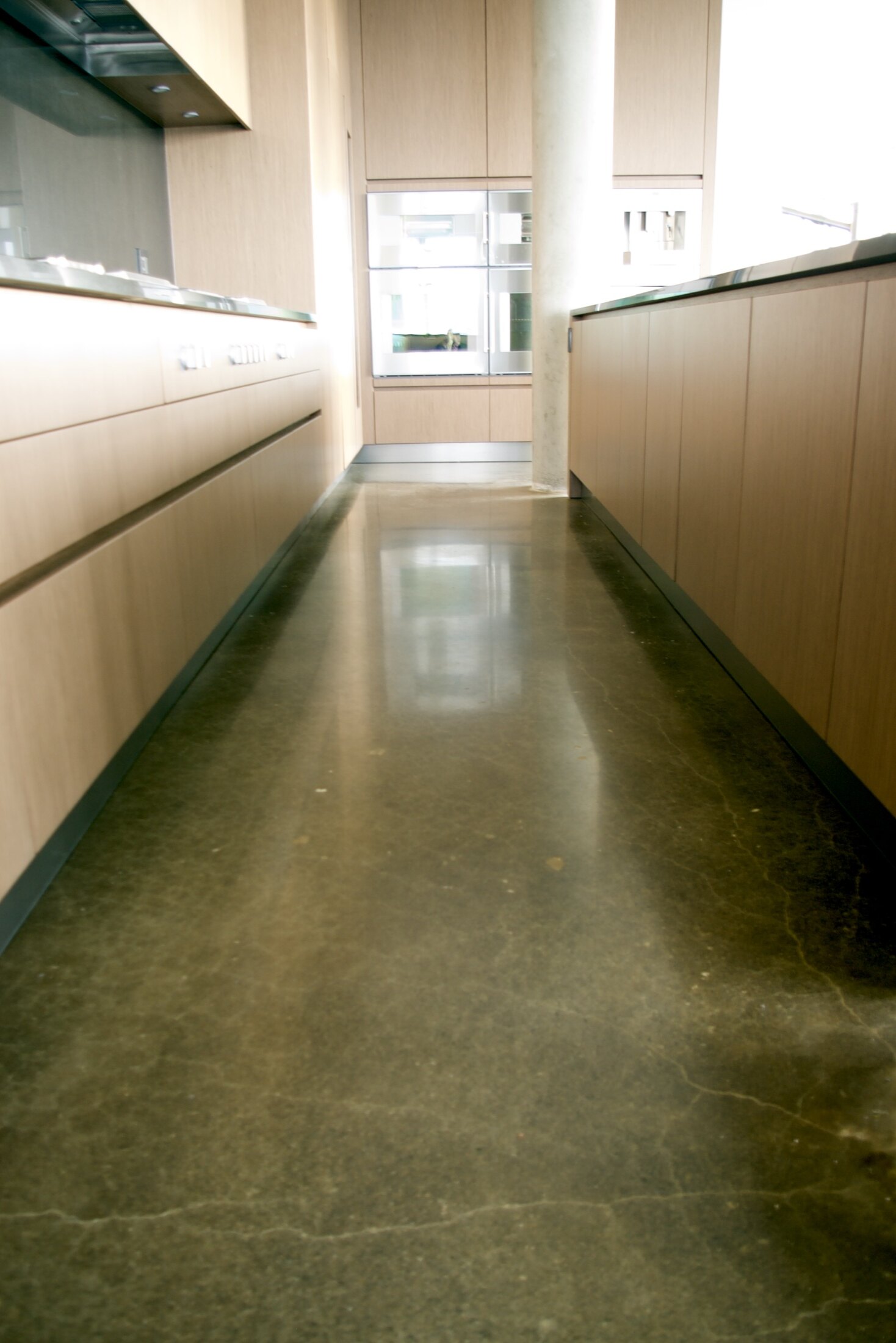 Unnamed residential kitchen with polished concrete floor.